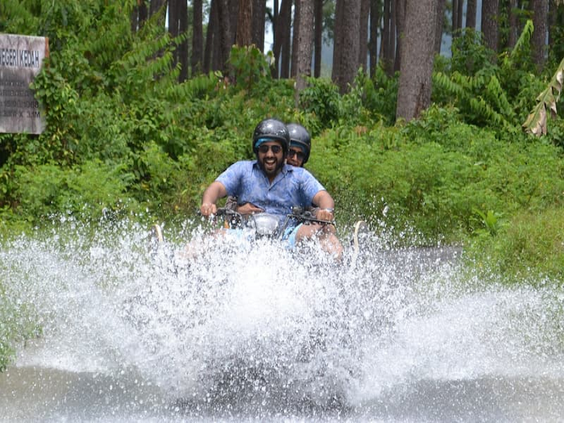 Tourists riding ATV through water at ATV Adventure Ride Langkawi