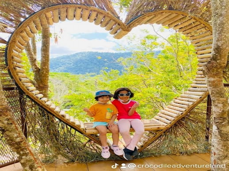 Children taking photo at treetopia Crocodile Adventureland Langkawi